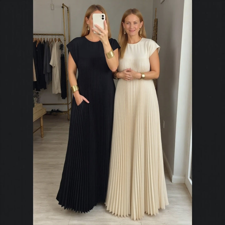 Women's pleated maxi dress styled with accessories, showcasing its versatile elegance for any summer occasion.