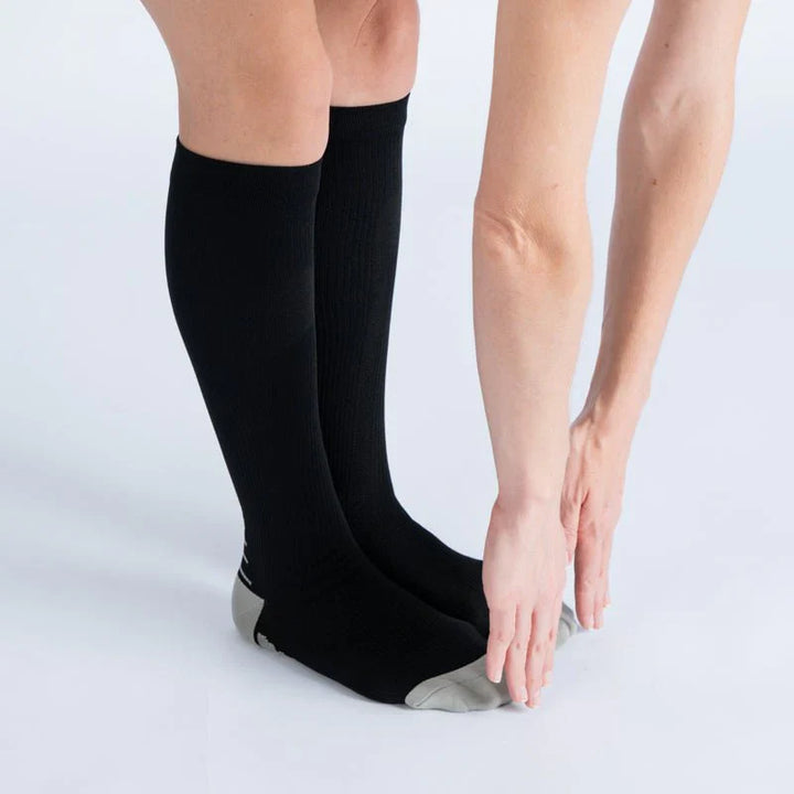 Unisex black and white compression socks, designed for all-day comfort and better circulation