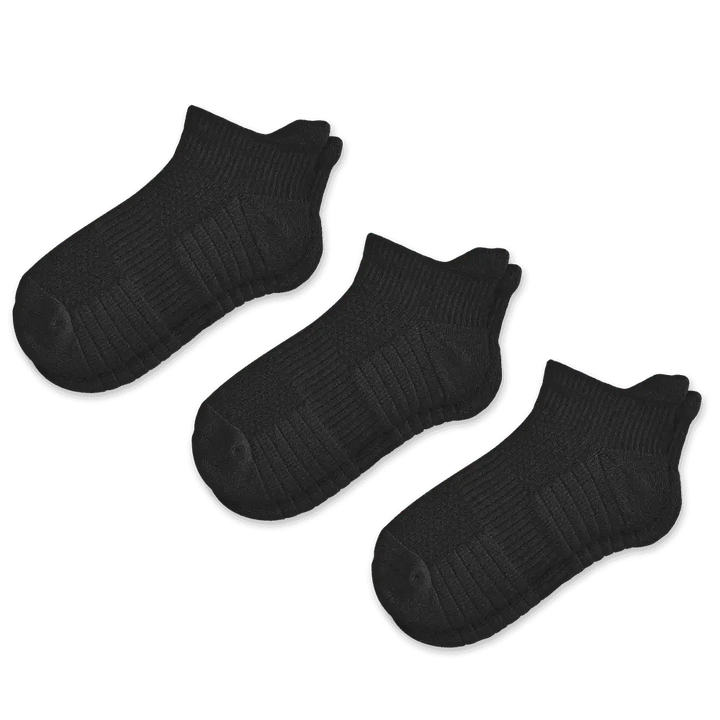 Lifestyle image of someone walking outdoors wearing unisex ankle compression socks for comfort