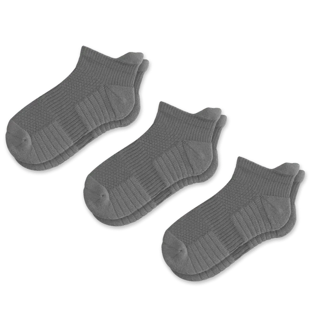 Close-up of the sole of a gray compression sock, showing reinforced areas for comfort and durability.
