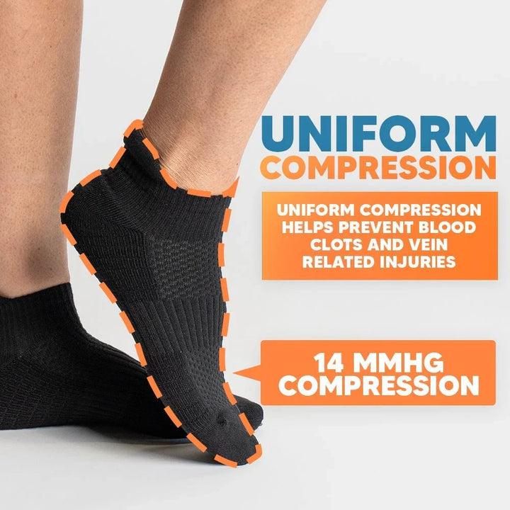 Detail shot of the elastic cuff of a gray ankle compression sock, providing snug ankle support.