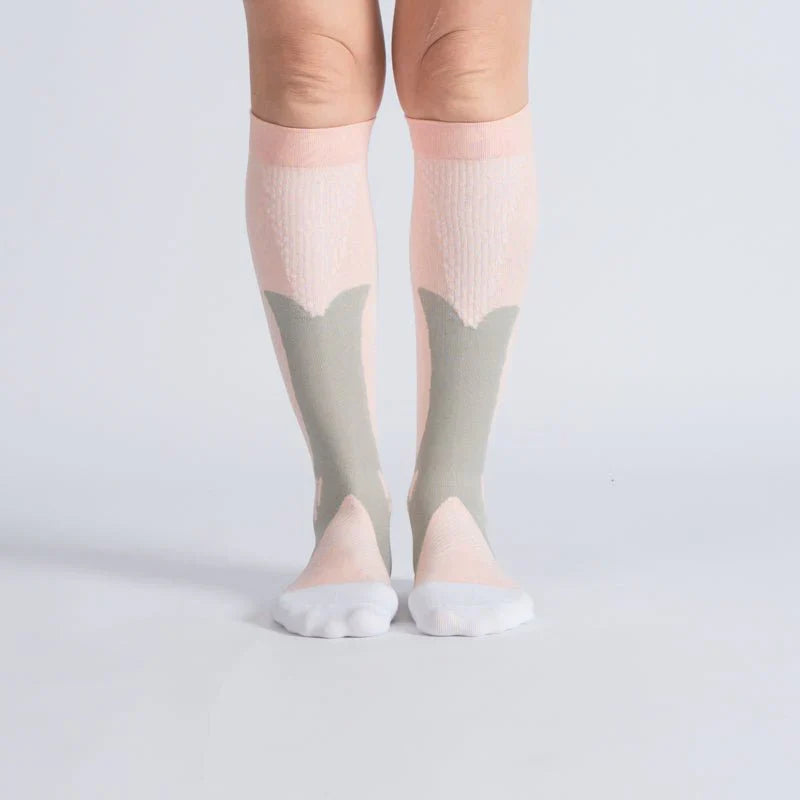 Pair of royal pink unisex gentle compression socks, offering comfort and support for improved circulation.