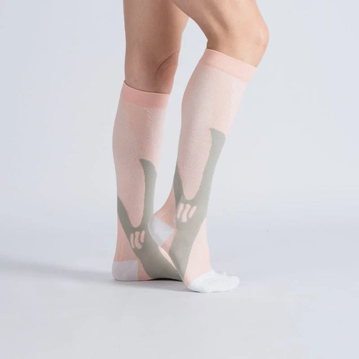 Royal pink compression socks for unisex wear, providing gentle support and promoting healthy circulation.