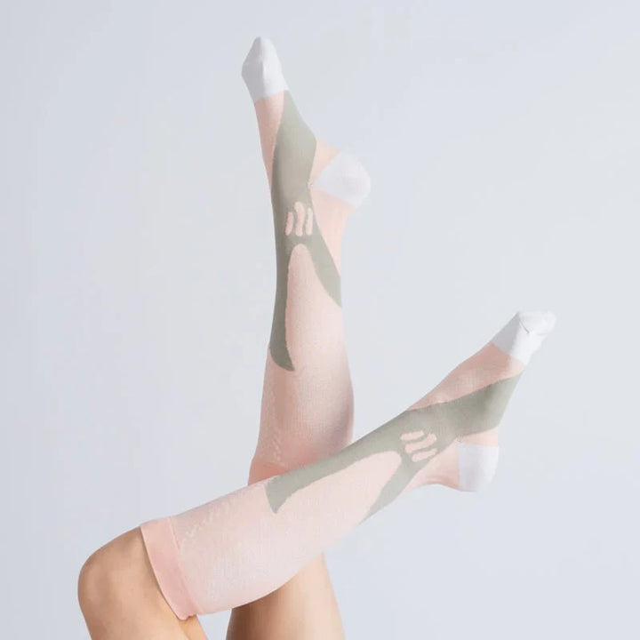 Unisex gentle compression socks in vibrant royal pink, footwear for improved circulation and daily comfort.