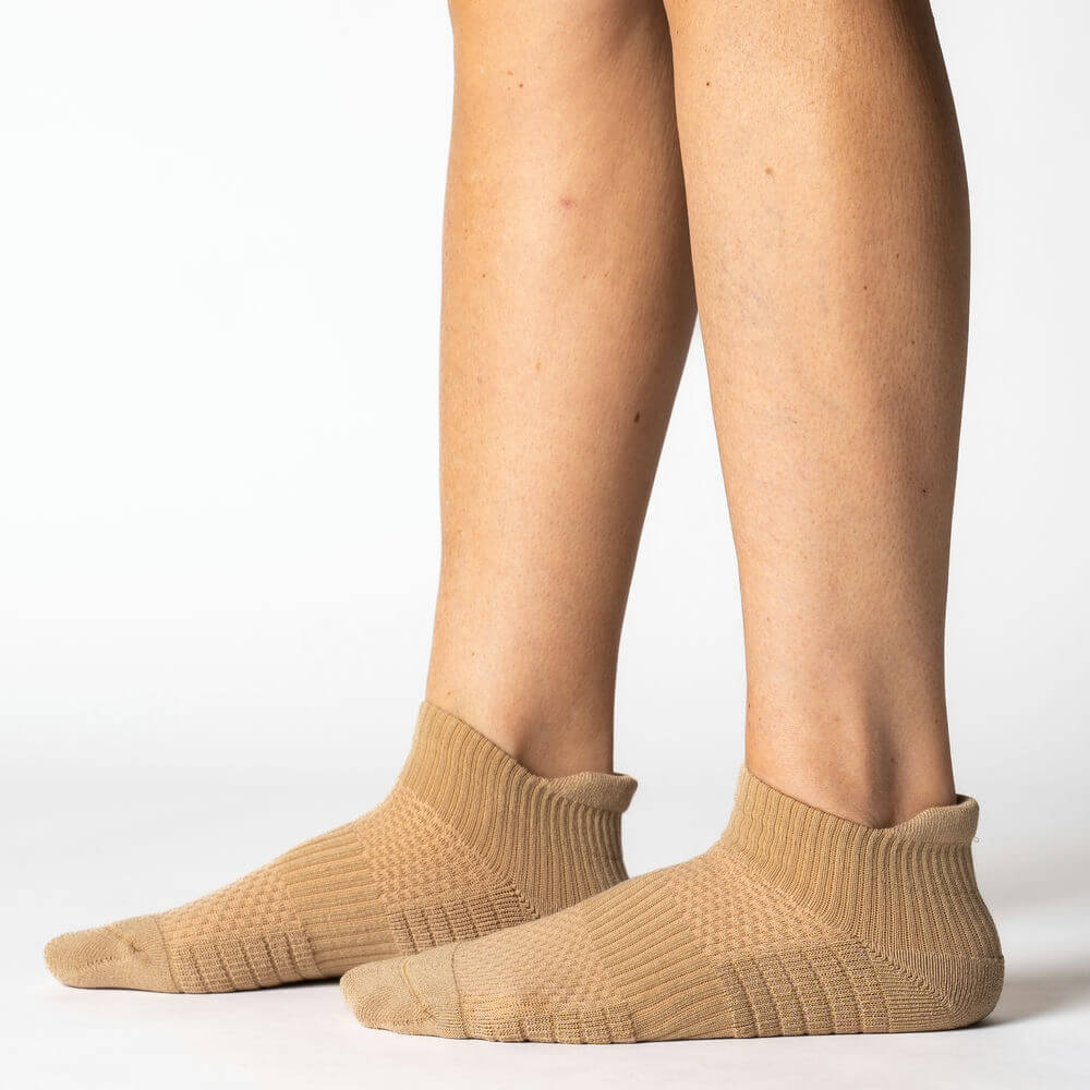 Unisex tan ankle compression socks for daily wear, offering mild pressure relief and ankle support.