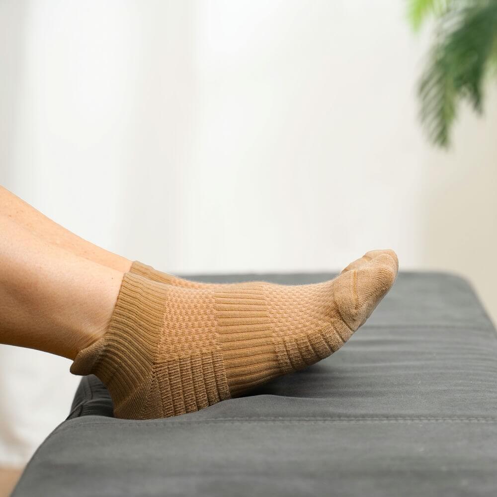 Tan compression ankle socks, ideal for unisex daily wear and effective foot pressure relief.