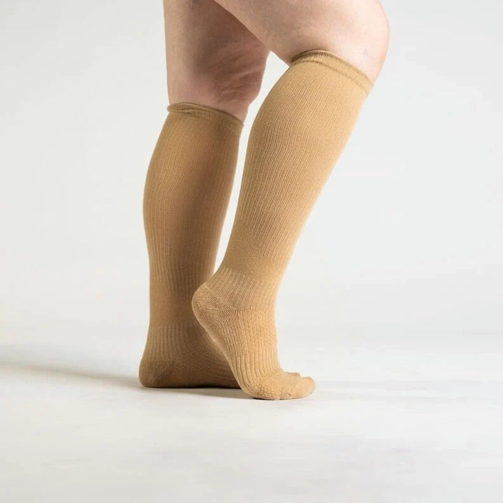 Close-up of the soft fabric of tan unisex gentle support compression socks, ideal for daily wear.
