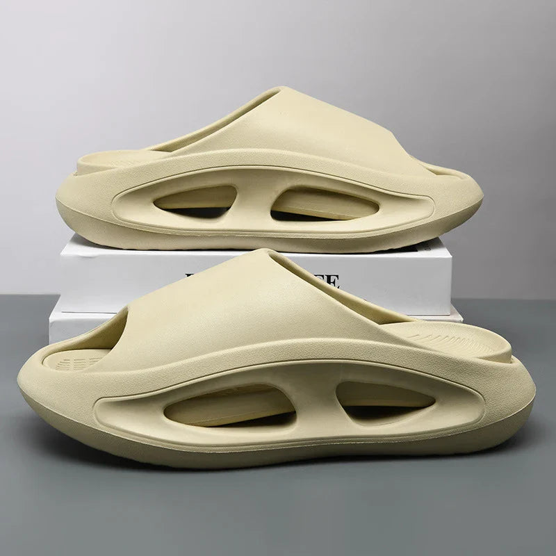 Close-up of the textured sole of a lightweight EVA cloud slide, highlighting its comfort and open-toe design.