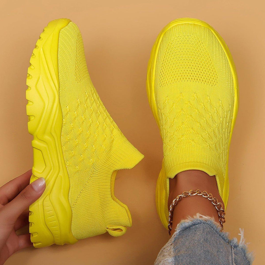 Pair of yellow Unisex Ortho Cloud Slip-On Shoes, side view, emphasizing comfort and orthopedic design