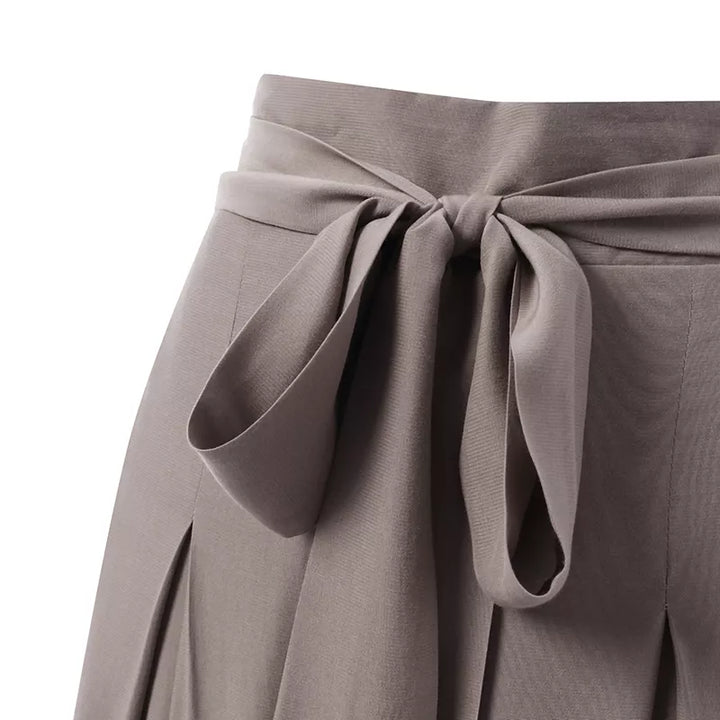 Chic plus-size wide-leg work pants, high-waisted for a flattering and professional women's fit.