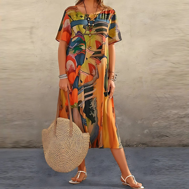 Flowy plus size women's maxi dress with eye-catching abstract print and practical short sleeves for a chic look.