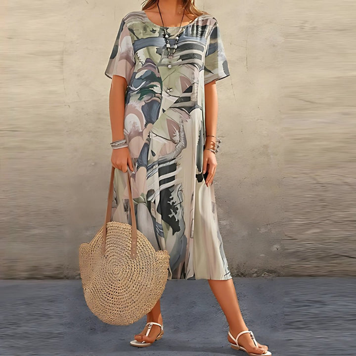 Women's plus size abstract print short sleeve maxi dress, a stylish and comfortable choice for casual fashion.