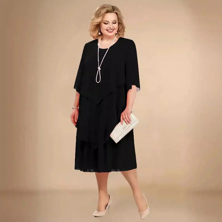Plus size women's elegant layered asymmetrical chiffon dress, perfect for wedding guests or parties.