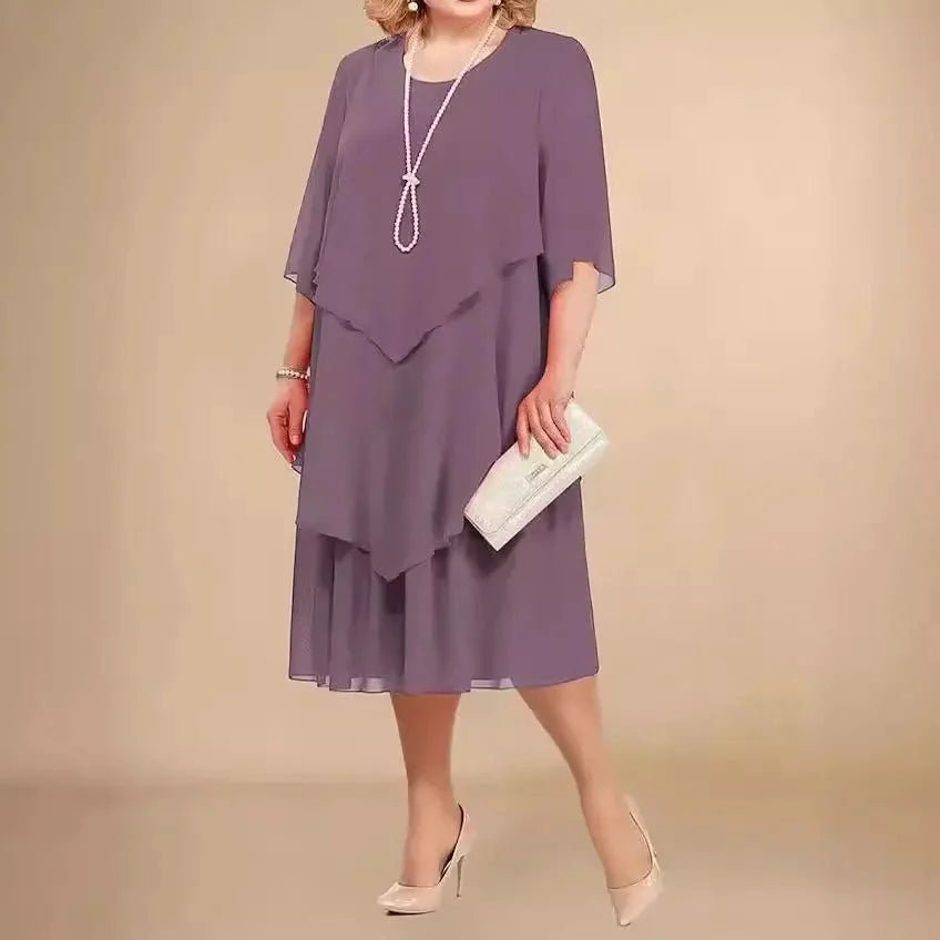 Stylish plus size knee-length asymmetrical dress with layers, flattering fit for formal women's occasions.