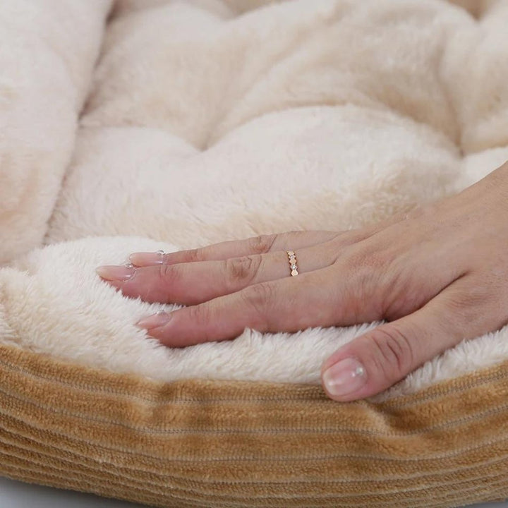 Non-slip plush dog bed for small to large dogs. Washable, soft pet bed for secure, cozy rest.