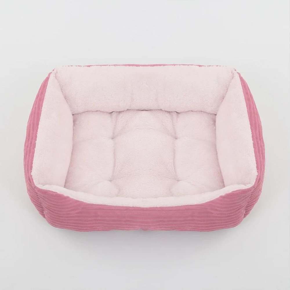 Secure plush dog bed for pets. Ultra-soft, washable pet bed with non-slip base for ultimate comfort.