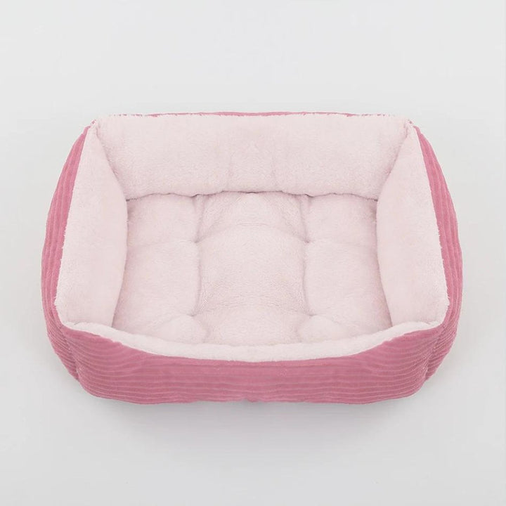 Secure plush dog bed for pets. Ultra-soft, washable pet bed with non-slip base for ultimate comfort.