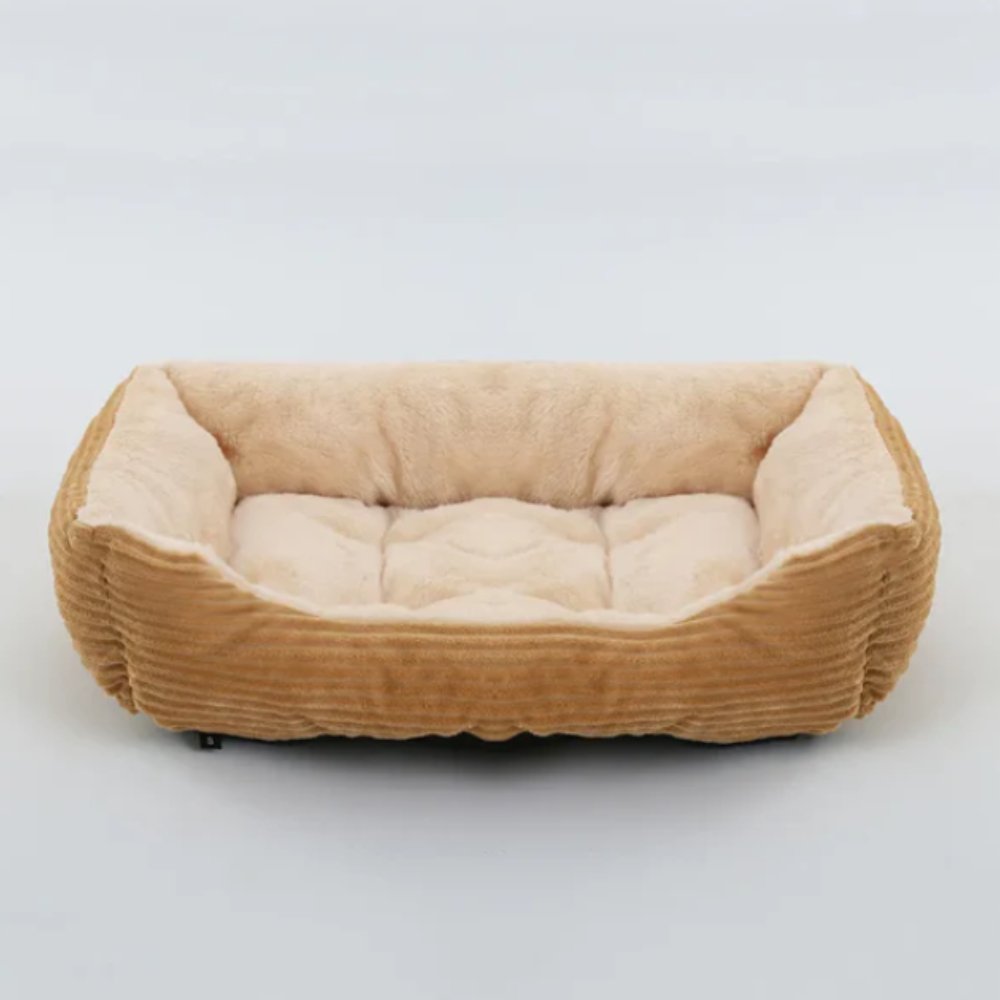 Unisex plush dog bed, soft & cozy. Washable pet accessory for ultimate comfort in any home.