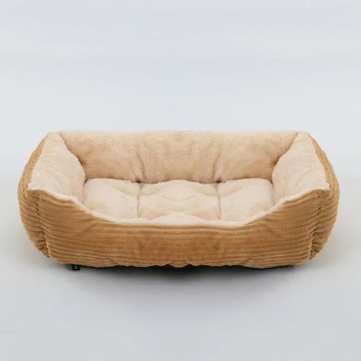 Unisex plush dog bed, soft & cozy. Washable pet accessory for ultimate comfort in any home.