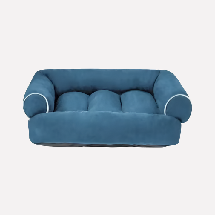 Plush U-shaped dog bed with high bolster for ultimate pet comfort, featuring a washable removable cover.