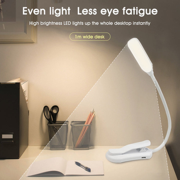 Portable black reading lamp with adjustable clamp, three color modes, and long battery life for custom lighting solutions.