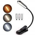 Portable black reading lamp with adjustable clamp, three color modes, and long battery life for custom lighting solutions.
