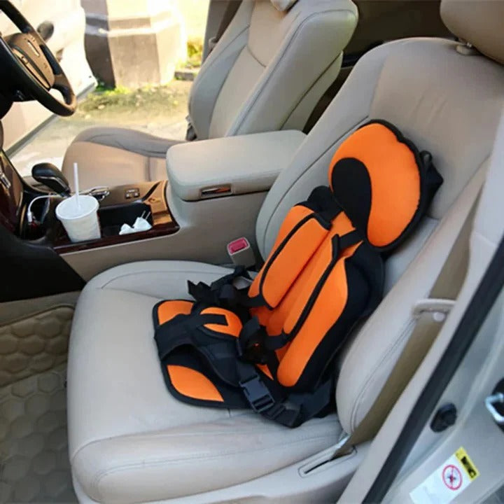 Compact foldable child car seat with 5-point safety harness, essential kids travel gear for car safety.
