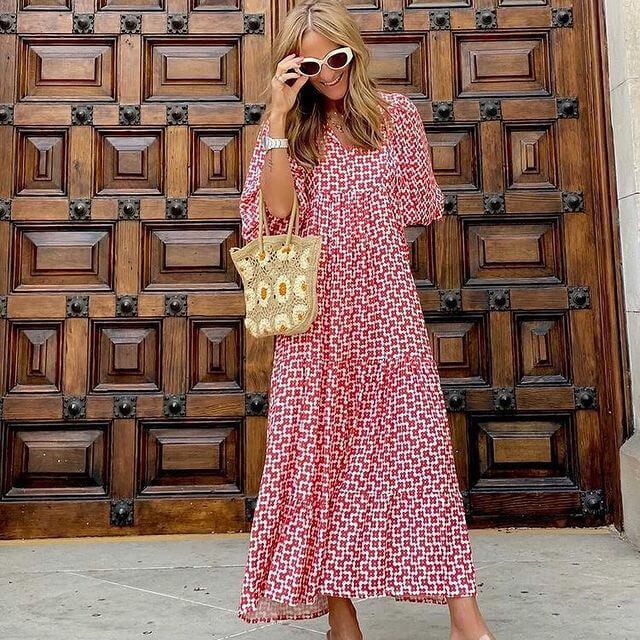 Printed beach party maxi dress, women's style, flattering waist, and flowy summer fabric.