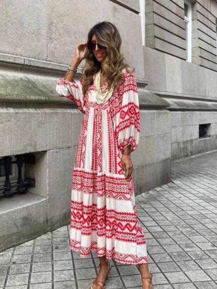 Flowy Aurelia printed maxi dress with short sleeves and comfortable elastic waistband.