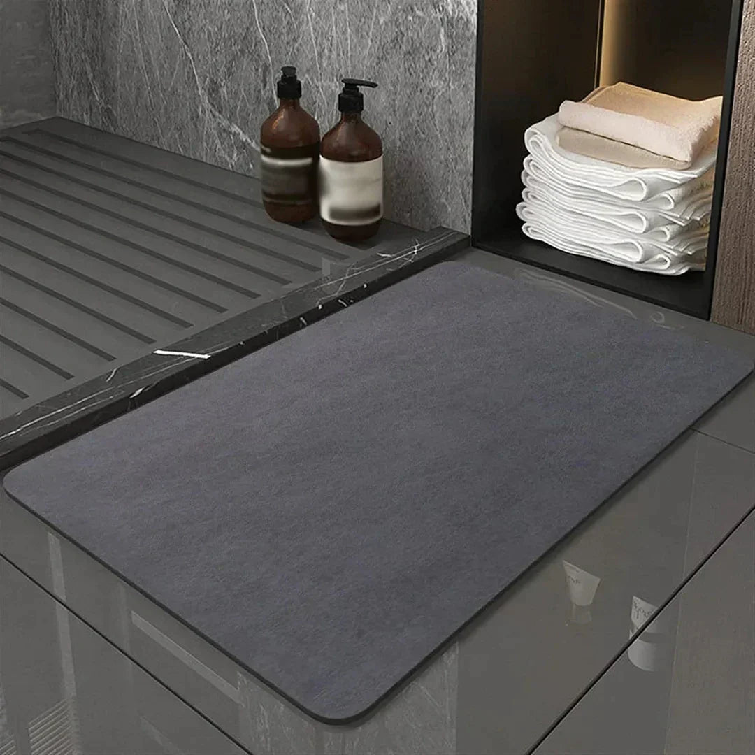 Quick-dry diatomite bath mat, highly absorbent for a dry, safe bathroom floor. Modern, eco-friendly home decor.