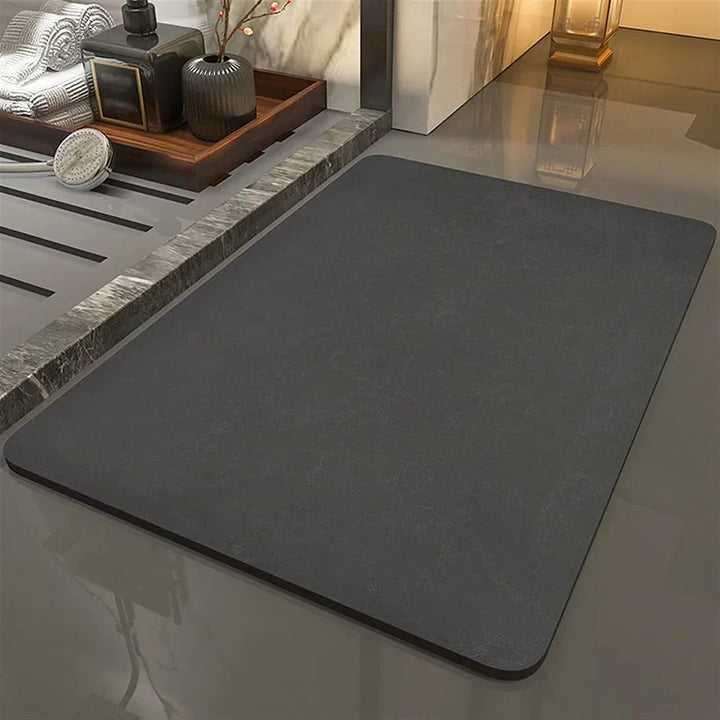 Elegant diatomite quick-dry bath mat, an anti-slip absorbent floor mat for a modern, safe bathroom.