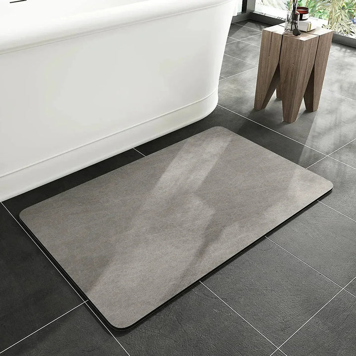 Close-up of quick-dry diatomite bath mat texture, showing its absorbent, anti-slip surface. Eco-friendly design.
