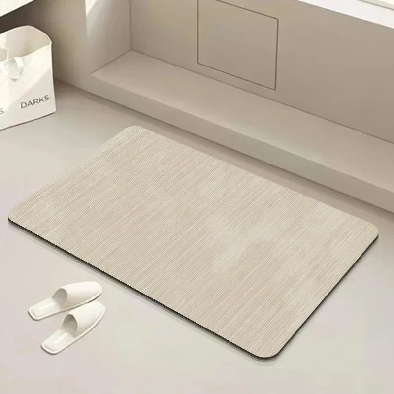 Stylish anti-slip diatomite bath mat quickly absorbs water, ensuring a dry & safe bathroom environment.