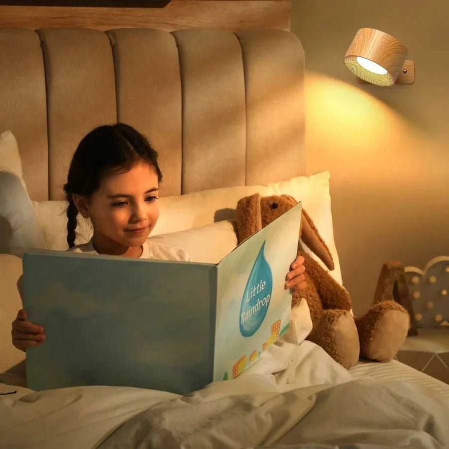 Elegant rechargeable wall light, 360° swivel head, warm LED, perfect for cozy reading nooks.