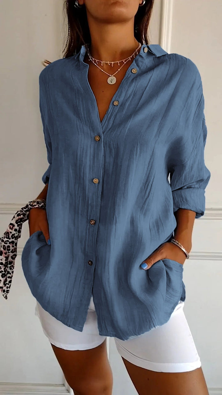 Comfortable oversized women's long sleeve button-down, a casual summer blouse.