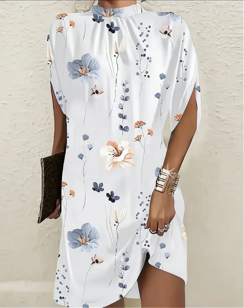 Modern women's mini dress featuring a chic mock neck and unique cape sleeves.