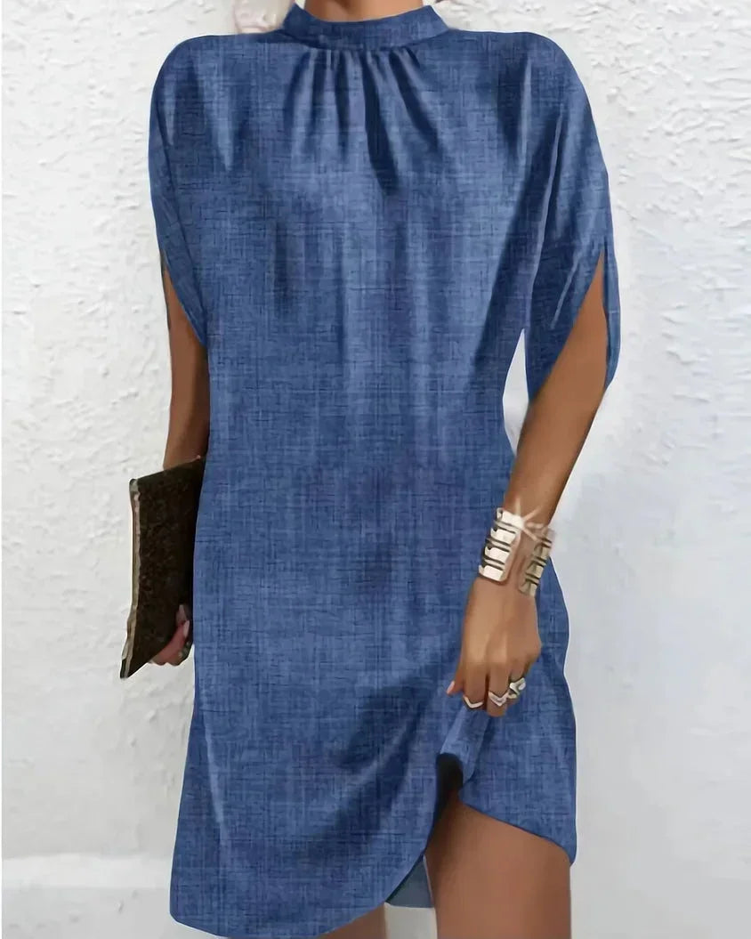 Elegant women's mock neck mini dress with stylish cape sleeves, perfect for parties.