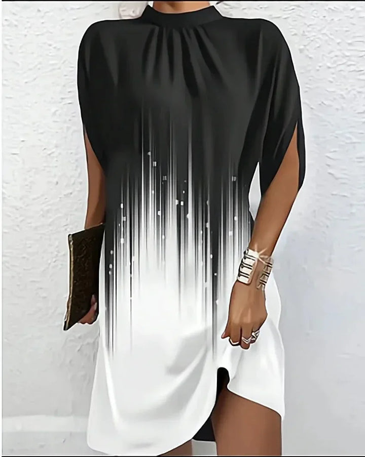 Stylish women's mock neck mini dress with statement cape sleeves, a key modern fashion piece.