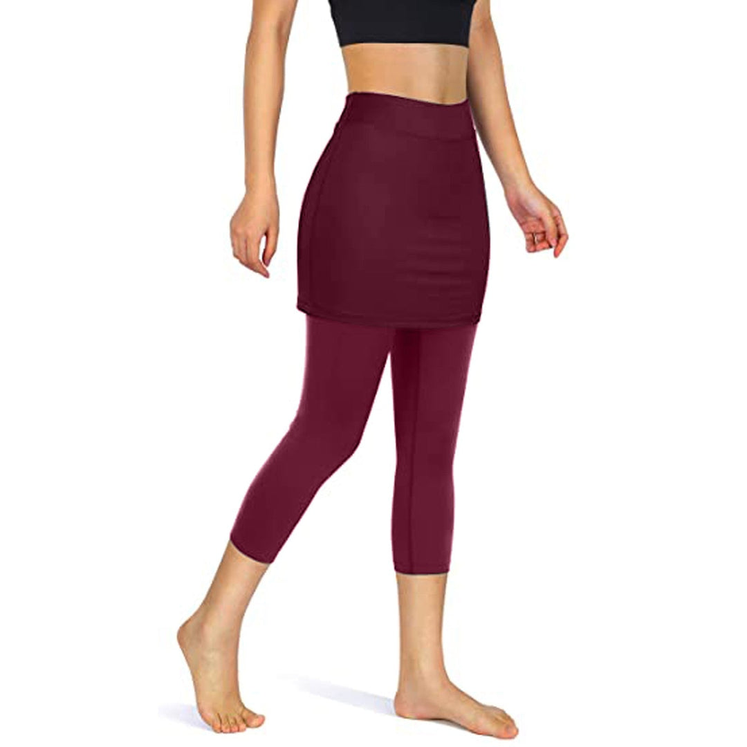 Sporty black skirted leggings for women, offering modest coverage and functional pockets.