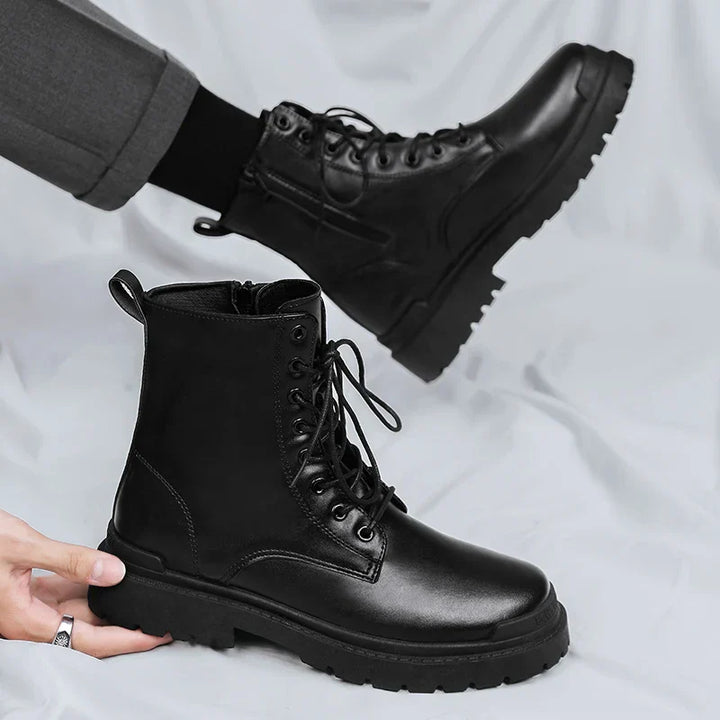 Durable men's combat work boots with secure lace-up and easy side zip. Tough black ankle footwear for rugged outdoor use.
