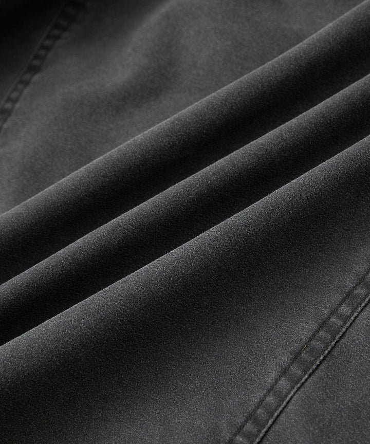 Men's charcoal canvas jacket, laid flat, displaying its rugged material and classic design.