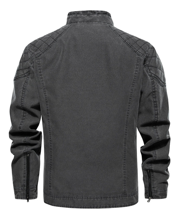 Close-up of the rugged canvas texture on a men's charcoal jacket, highlighting fabric quality.