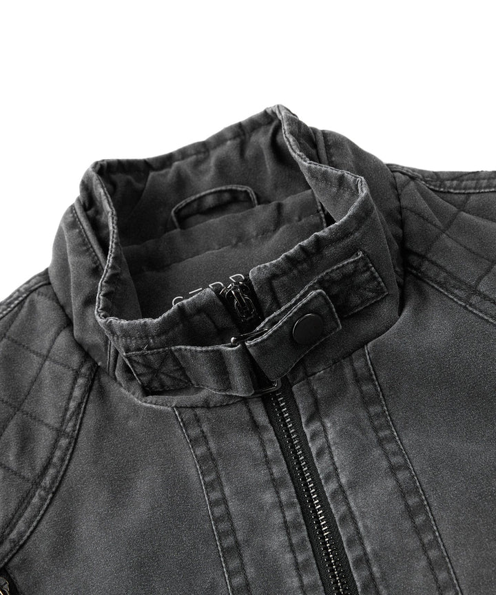 Side profile of a man wearing a rugged charcoal canvas jacket, suitable for motorcycle use.