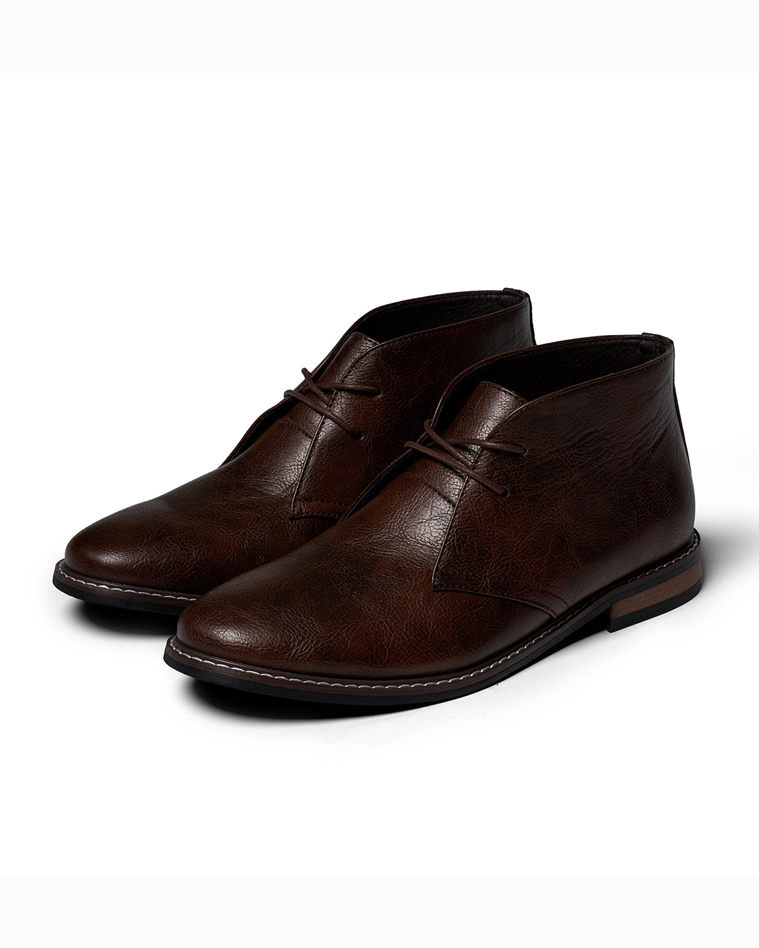 Rugged men's dark brown leather ankle boots, side view, natural light, casual style