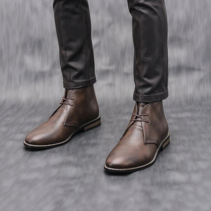 Stack of rugged men's dark brown leather ankle boots, various sizes, high quality mens fashion