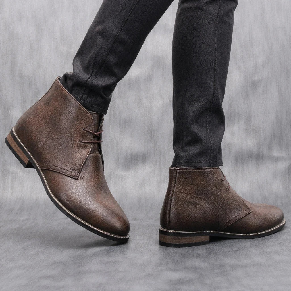 Rugged men's dark brown leather ankle boots, styled with jeans, versatile casual footwear