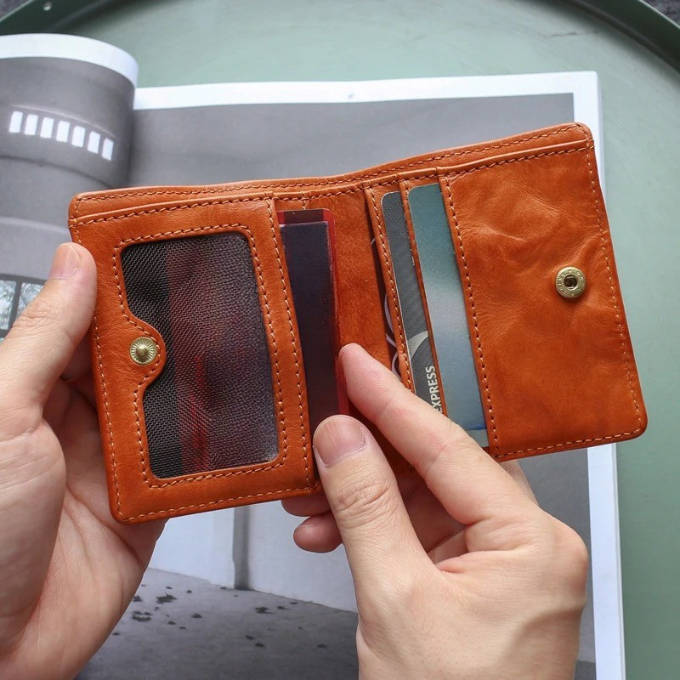 Back view of the cowhide leather men's tri-fold wallet, highlighting its natural grain and finish