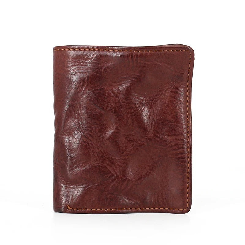Rugged men's accessories: Close-up of a full grain leather tri-fold wallet with a distressed look