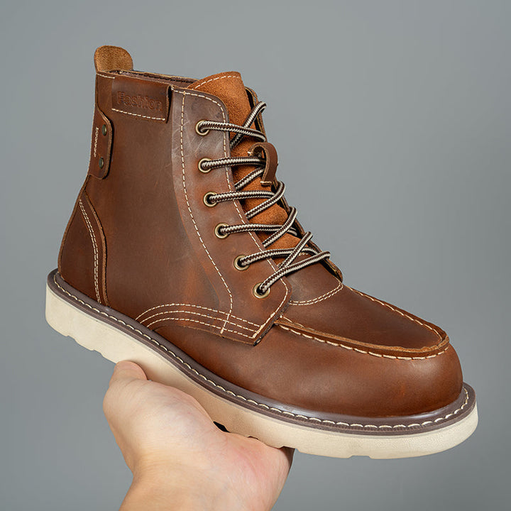 Close-up of the rugged brown leather texture on a waterproof men's chukka boot