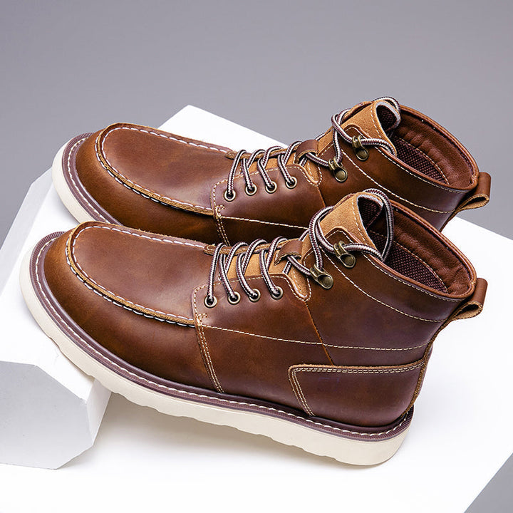Black men's waterproof chukka boots, against a white background, for clear product visibility